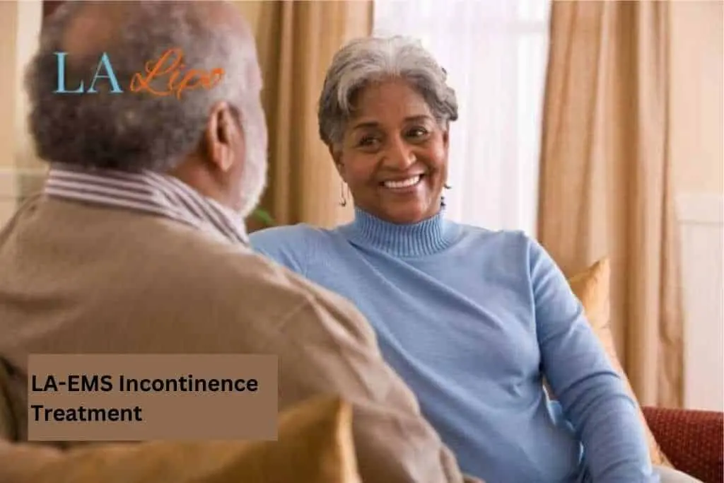 Couple sat smiling at each other - LA-EMS treatment Feltham
