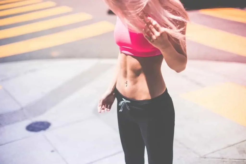 Woman with toned stomach after LA-EMS Body Sculpting Treatment Feltham 